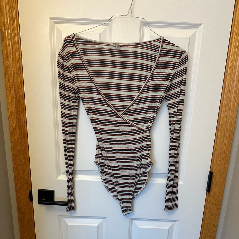 Medium striped bodysuit. Long sleeve, deep v-neck. 2 snap closure.